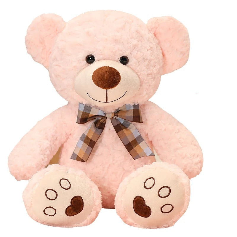 Adorable Ours en peluche rose de 35cm avec nĆud papillon Ă carreaux.