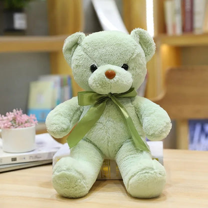 Ours en peluche vert clair, nœud satiné, doux, mignon, câlin.