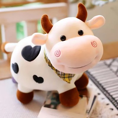 Adorable Peluche vache blanche et noire avec foulard jaune.